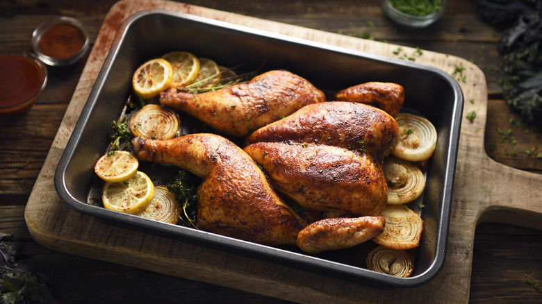 Butterfly-cut chicken in baking pan