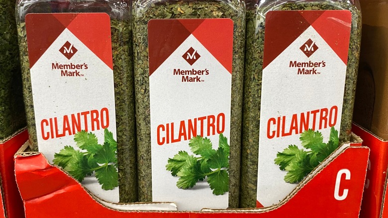 bottles of Members Mark cilantro sit in a box