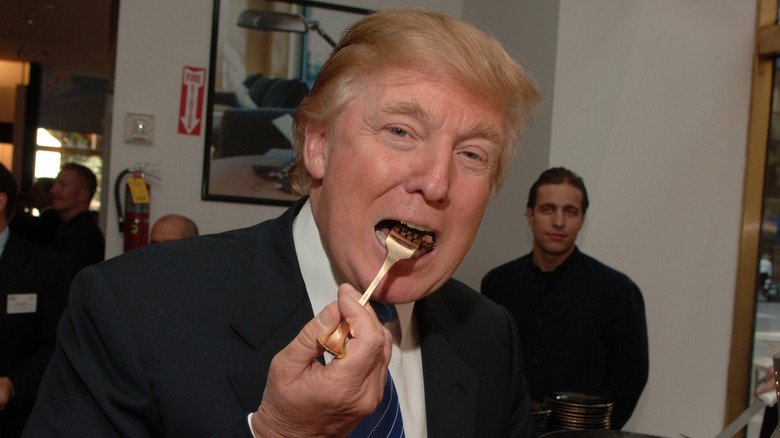 president Donald trump eating with fork