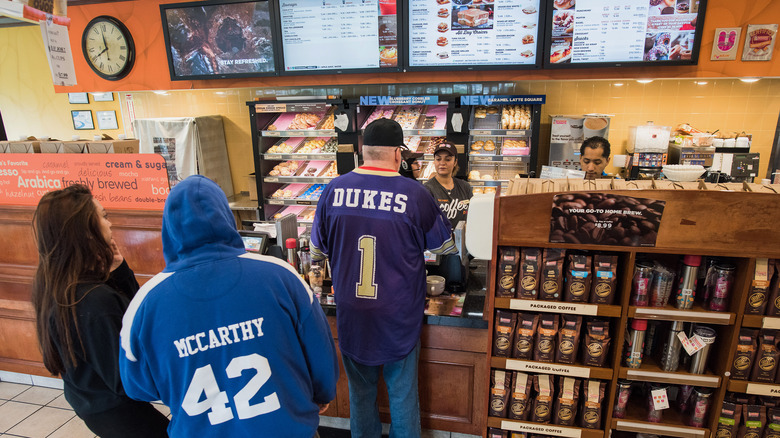 Dunkin' employee greets customers