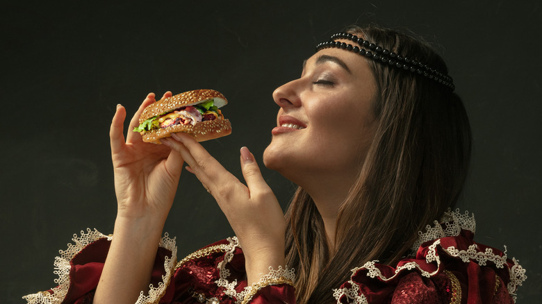 renaissance woman with burger