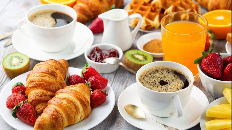 continental breakfast with pastries, fruit, coffee, and juice