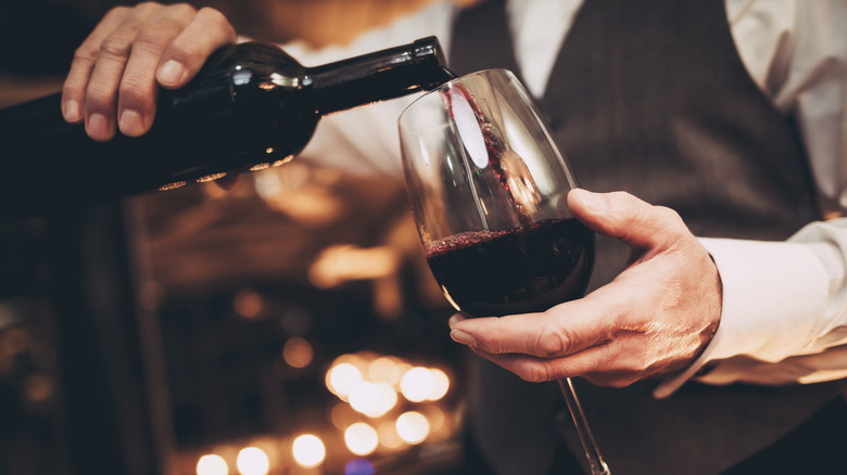 waiter pouring wine