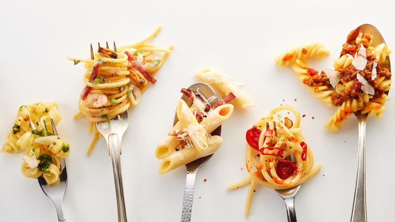 Different types of pasta on forks