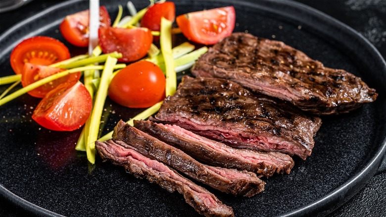 sliced steak with tomatoes 