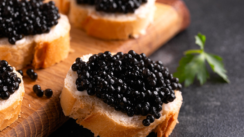 black caviar on bread slices