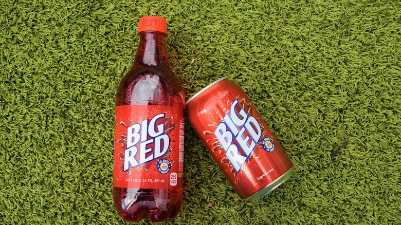 Big Red soda bottle and can