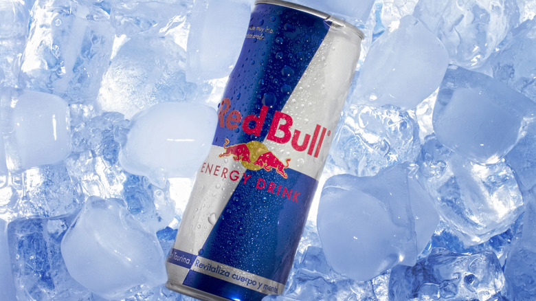 Red Bull energy drink can on ice