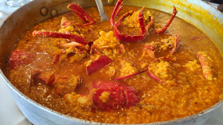 a lobster in a pot with soup