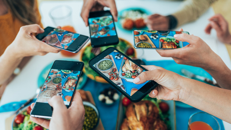 a group of phones taking food photos
