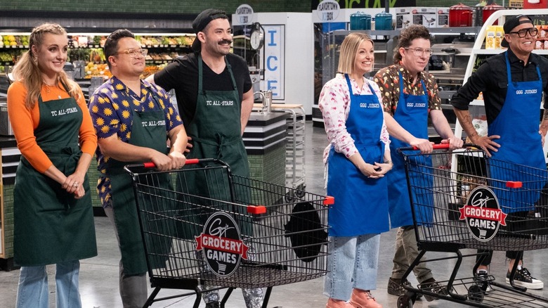 Contestants with big smiles while competing on "Guy's Grocery Games"