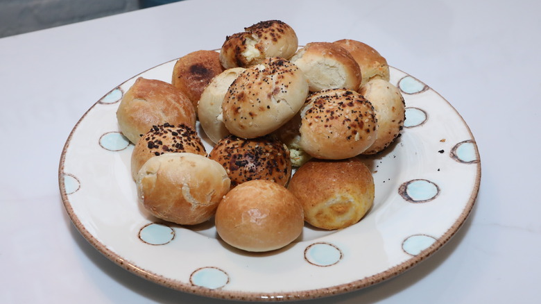 Bantam Bagels bagel bites filled with cream cheese piled on a plate