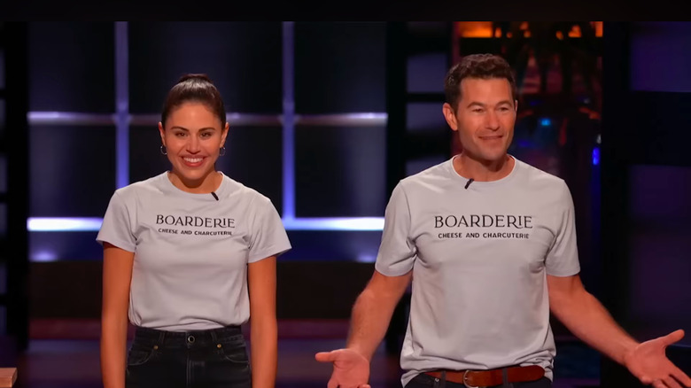 Rachel Solomon Fascitelli and Aaron Menitoff from Boarderie smiling on "Shark Tank"