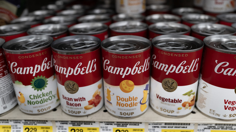 Assortment of Campbell soup on grocery store shelves