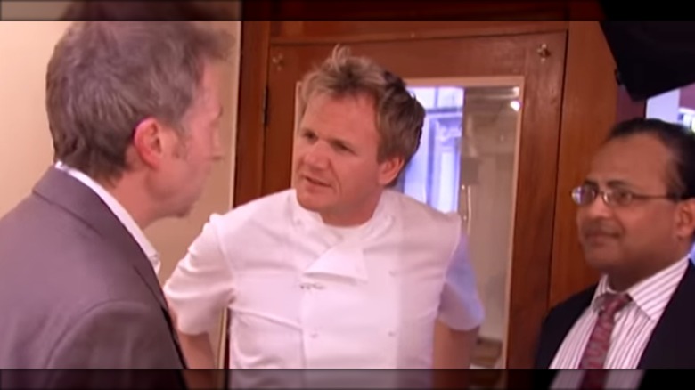 Chef Gordon Ramsay has words with restaurant staff on his show "Kitchen Nightmares"