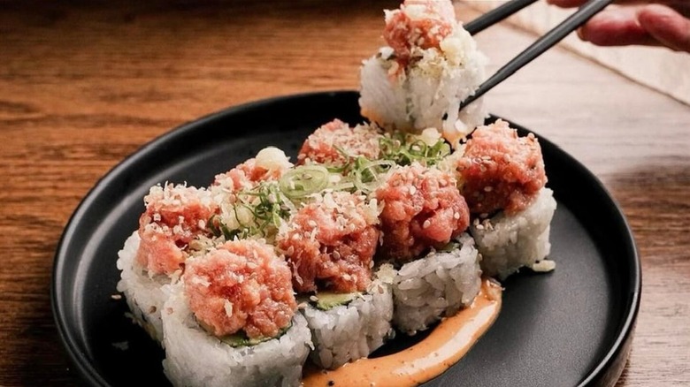 Plant-based tuna in sushi on black plate
