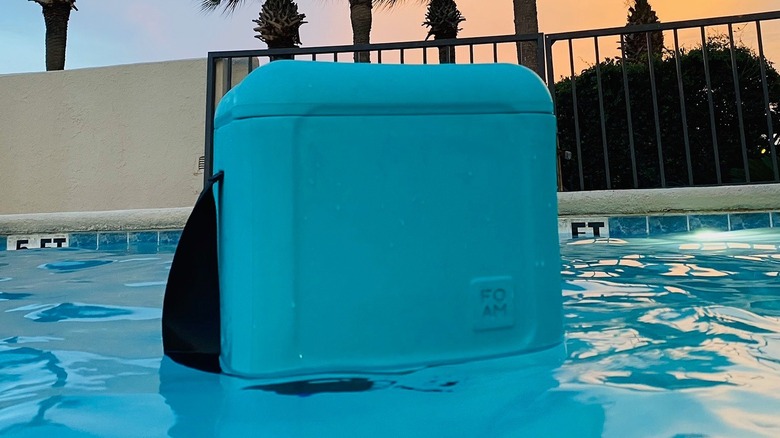 Foam Cooler floating in a pool with palm trees