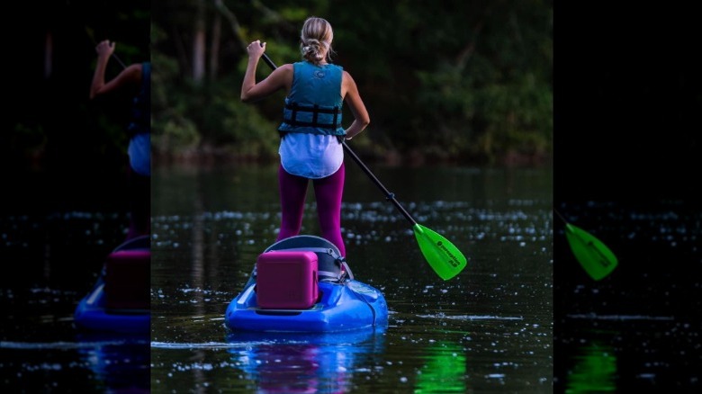 Paddle boarder with foam cooler