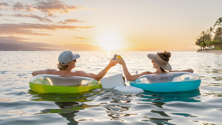 Couple floating with FOAM Cooler