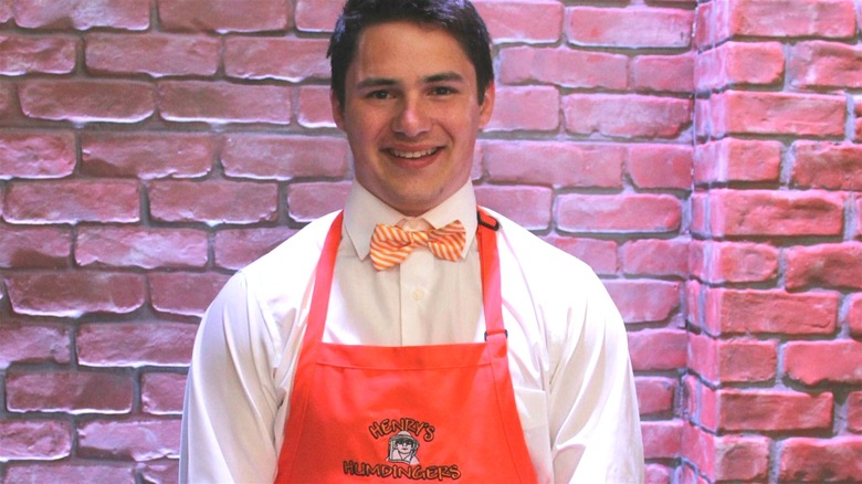 Henry's Humdingers founder in red apron