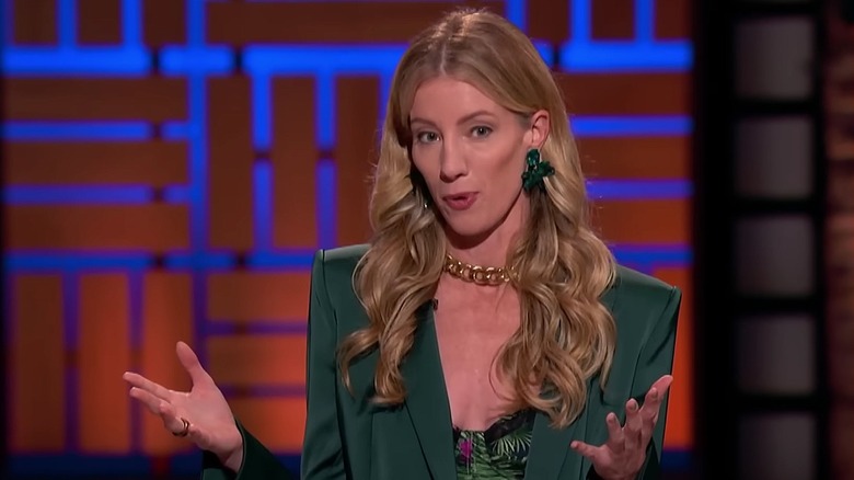 Megan Klein in green suit on "Shark Tank" set