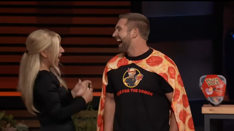 Tate Koenig and Lori Greiner celebrating on Shark Tank