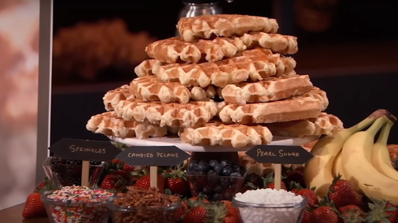 stack of Belgian waffles with toppings