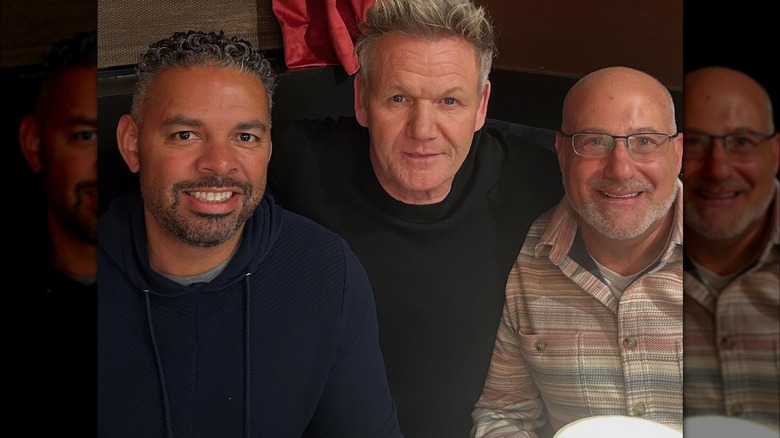 Gordon Ramsay posing for picture with owners of Savin restaurant
