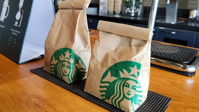Starbucks bags waiting on the counter