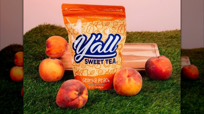 Georgia peach Y'all Sweet Tea packet with peaches on grass