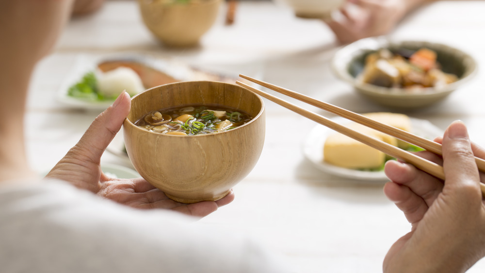Eating soup with tofu