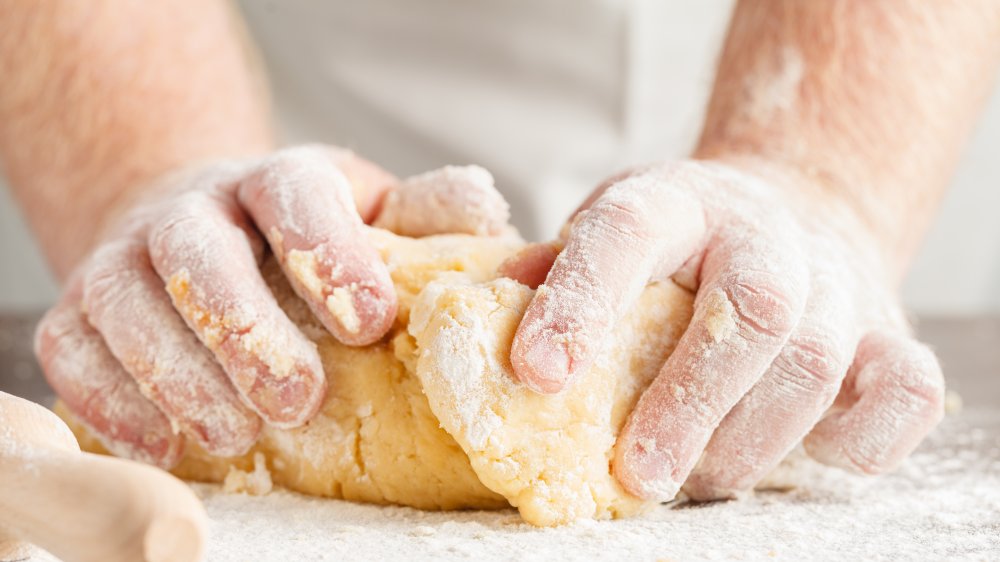 cake batter being poured into a pan