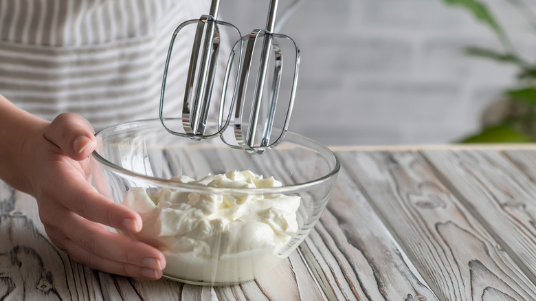 baker mixing cake batter