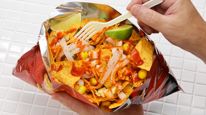 doritos with hot sauce, lime, corn