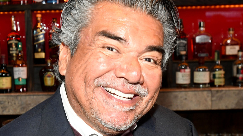 George Lopez smiling in bar