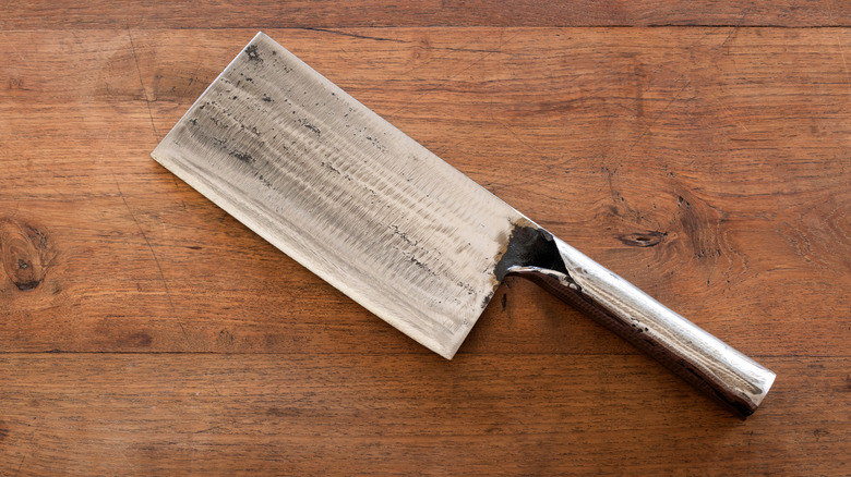 Chinese cleaver on wooden background