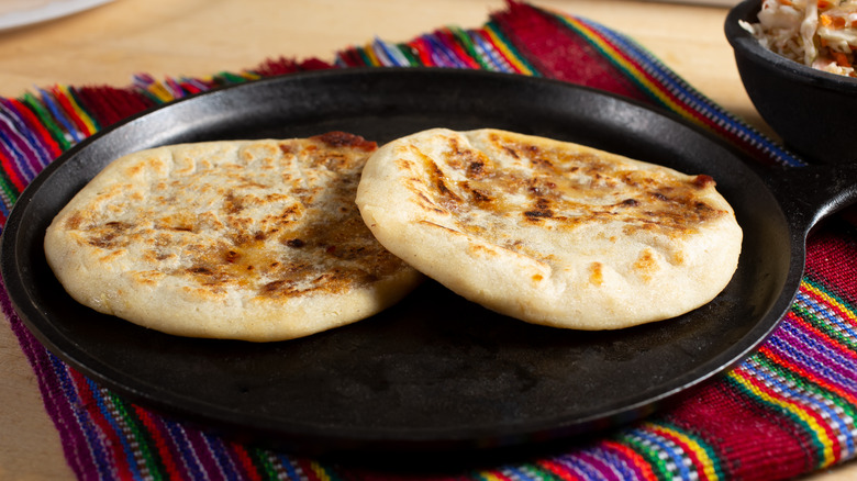 Breads on a comal on a blanket