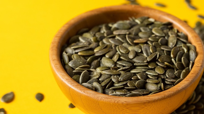 Wood bowl filled with pepitas