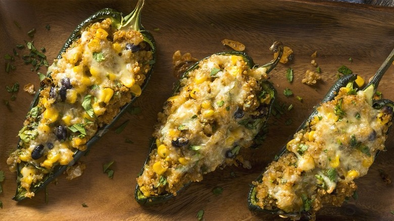 Three stuffed long green peppers