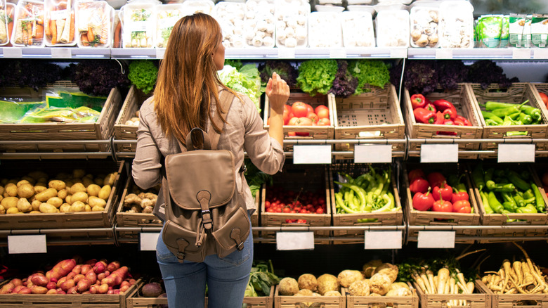 Woman shopping for fresh vegetables