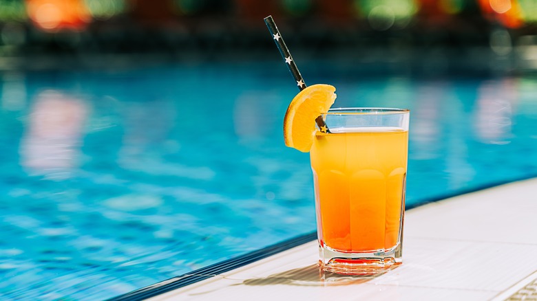 A cocktail with mint and orange slices