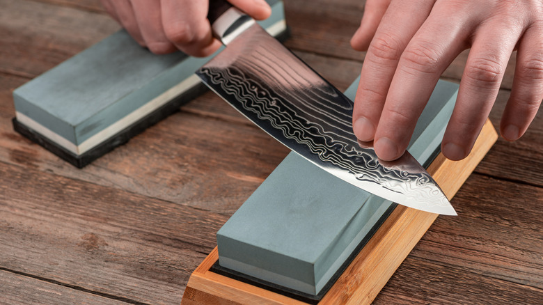 Sharpening a knife on a whetstone