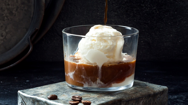 Clear glass with espresso poured over vanilla ice cream