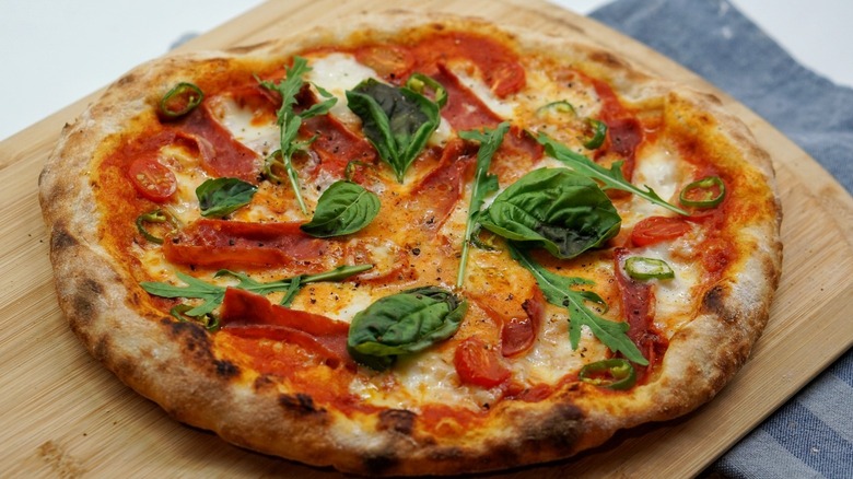 Margherita pizza with basil leaves