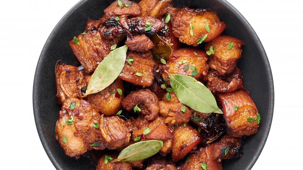 carne adobada pork in sauce with bay leaves 