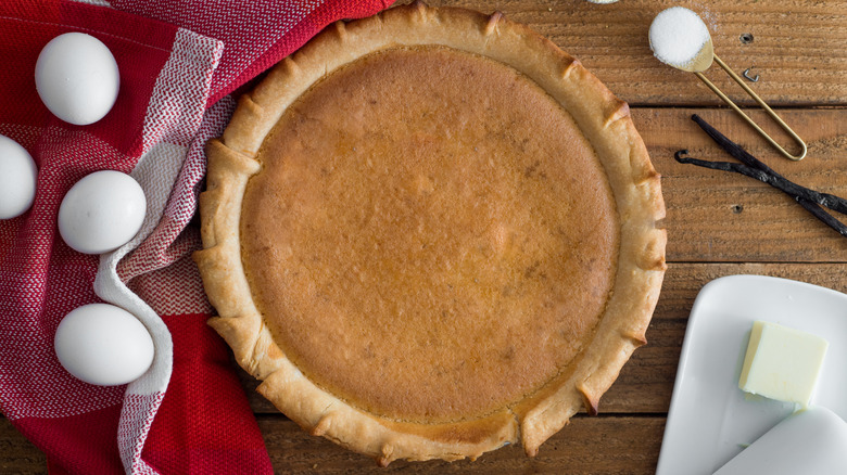 Chess pie on a table with butter and eggs