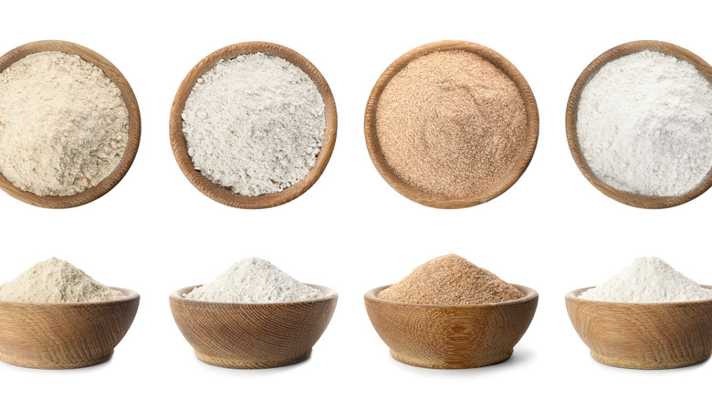 Various brown and white coconut flours in small bowls