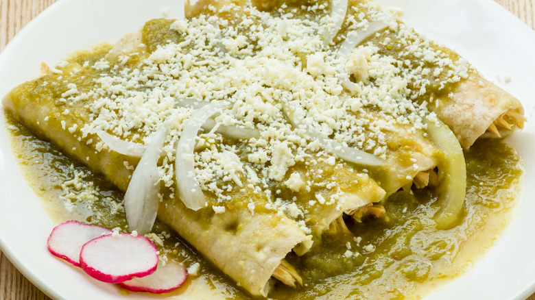 Enchiladas with green sauce and cotija cheese