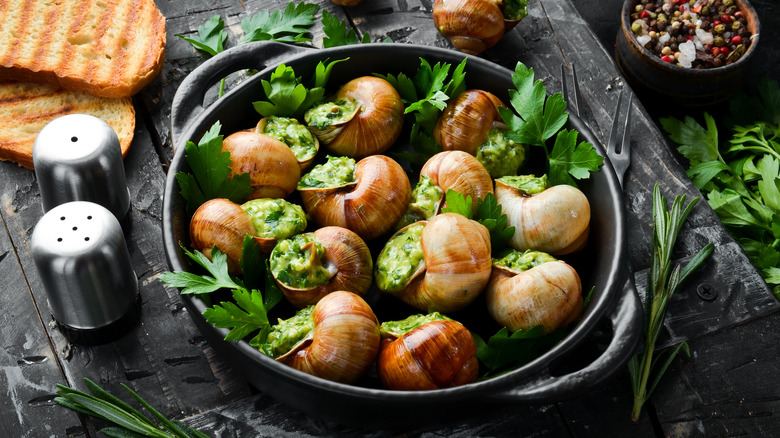 Dish of escargot with herbs