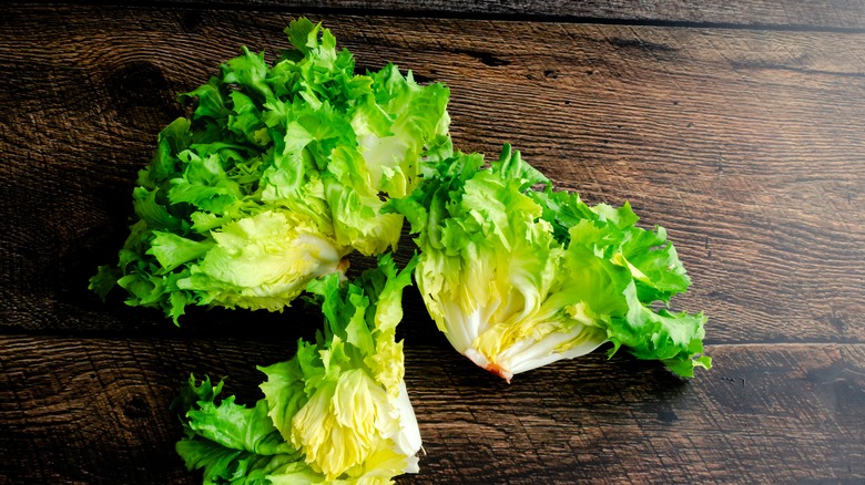 aerial view of fresh escarole on wooden board